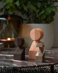 Three Gardeco Ceramic Sculptures The Muses Plus Clio Natural sit on top of a marble table.