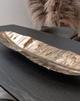 Gardeco Bronze Folha Bananeira Small Leaf Glass Platter displayed on a modern black table at Spacio India, luxury home decor accessory.
