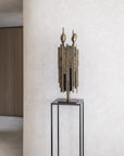 Abstract sculpture on a pedestal against a light wall called Luxta from Gardeco available at Spacio retail stores in Mumbai & Kolkata