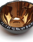 Close-up of the reflective bronze glass interior of the Gardeco P Bronze Bowl, highlighting the artisanal texture and sculptural beauty, presented by Gardeco and retailing at Spacio India.