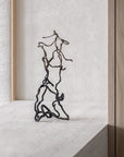 Gardeco To Return bronze metal sculpture styled on a concrete windowsill, showcasing artistic decor available at Spacio India for modern interiors.