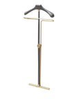 A folded gold and black coat stand on a white background