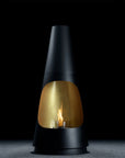 Black and gold fireplace with visible flame on a dark background