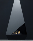 A modern black freestanding fireplace with a geometric triangular design and visible flames, set against a dark charcoal background.