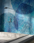 An interior bathroom with a blue tiled wall, promoting wellness and featuring the Glamfusion Hydra Hydronetta from Glamora Collection.