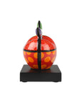 Decorative apple sculpture on a white background by Romero Britto available at Spacio retail and online stores in India.