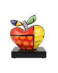 Colorful apple sculpture with a base on a white background by Romero Britto available at Spacio retail and online stores in India.