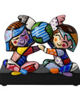 Colorful figurine of two people holding hands with a world map between them on a white background by Romero britto available at Spacio retail and online stores in India.