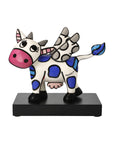 Colorful cow figurine with zebra stripes on a white background by Romero britto available at Spacio retail and online stores in India.