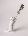 A Haoshi Chipmunk Vase Present 01 in a vase holding a leaf on display.