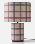 A checkered pattern fabric table lamp on a white background
