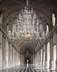 Grand Italamp Dogma chandelier installed in a classical hallway, showcasing Italian crystal craftsmanship, available at Spacio India.
