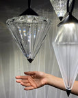 Hand interacting with the crystal diffuser of the Italamp Donna Suspension Lamp, highlighting the brilliance and material quality – Spacio India