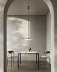 Italamp Gilda Suspension Lamp with hand-carved crystal diffuser in a soft grey modern dining setting. Luxury Italian lighting available at Spacio India.