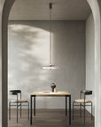 Italamp Gilda Suspension Lamp with hand-carved crystal diffuser in a soft grey modern dining setting. Luxury Italian lighting available at Spacio India.