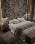 Symmetrical interior design with Italamp Gilda Suspension Lamps over bedside tables in a carved wall bedroom. Artistic Italian lighting at Spacio India.