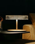 Close-up of Italamp Gilda table lamp with corten base and crystal diffuser, designer table lamp from Italy available at Spacio India.