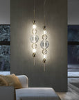 Dual Italamp Greta Suspension Lamps illuminating a modern living area, featuring crystal spheres and metallic accents – Spacio India exclusive.