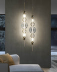 Dual Italamp Greta Suspension Lamps illuminating a modern living area, featuring crystal spheres and metallic accents – Spacio India exclusive.