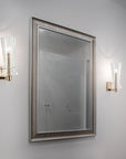 Italamp Licio wall lamps in brushed gold finish flanking a mirror, perfect for modern vanity or powder room styling – available at Spacio India