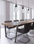 Gold-shaded Italamp Nola Pendant Lamp elegantly suspended over a dining table, Italian pendant lighting available at Spacio India.
