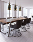 Gold-shaded Italamp Nola Pendant Lamp elegantly suspended over a dining table, Italian pendant lighting available at Spacio India.
