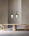 Green Italamp Rose Maxi Pendant Lamp displayed above a dining table, showcasing elegant Italian lighting available at Spacio India.