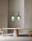 Green Italamp Rose Maxi Pendant Lamp displayed above a dining table, showcasing elegant Italian lighting available at Spacio India.