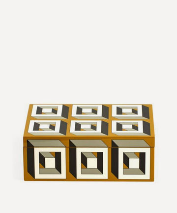 A rectangular box with black and white squares on it, featuring a contemporary style, the Jonathan Adler JA Lacquer Arcade Box Ochre.