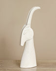 Side look of Jonathan Adler on Menagerie Gazelle white Sculpture on wood surface available at Spacio India for Luxury Home Decor collection of Sculpture & Art Objects.