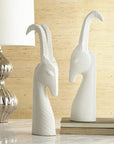 Jonathan Adler Two Menagerie Gazelle white porcelain Sculptures with books & table lamp available at Spacio India for Luxury Home Decor collection of Sculpture & Art Objects.