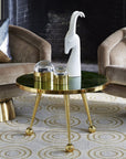Jonathan Adler Menagerie Gazelle white Sculpture on a gold coffee table in an interior available at Spacio India for Luxury Home Decor collection of Sculpture & Art Objects.