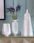Jonathan Adler Arco large porcelain vase with other sizes of arco collection on a console table in interior available at Spacio India for Luxury Home Decor Accessories collection.
