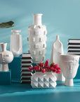 Jonathan Adler Arco large porcelain vase on a pedestal with other collection of Vases available at Spacio India for Luxury Home Decor Accessories collection.