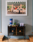 Jonathan Adler Scala Stripe Canister Vase with home accessories decor on a console table in a minimalist interior available at Spacio India for Luxury Home Decor Accessories collection.