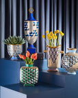 Jonathan Adler Cube Urn Vase with other Versailles Vases on a blue pedestals available at Spacio India for Luxury Home Decor Accessories collection.