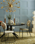 Jonathan Adler Camille Bust Sculpture styled atop a modern pedestal in a contemporary dining setting, accentuating luxury interiors, from Spacio India stores and online.