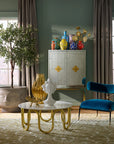 Modern living room showcasing Jonathan Adler Camille Bust Sculpture on a stylish coffee table, adding artistic elegance, available at Spacio India.