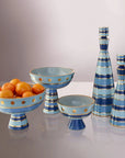 Jonathan Adler Chroma Large Blue Decanters styled elegantly on a designer sideboard in a luxury dining room setting, available at Spacio India.