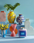 Jonathan Adler Druggist Eye Vase featuring surrealist blue and gold design on high-fired porcelain, displayed with eclectic vases – available at Spacio India stores and online
