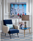 Jonathan Adler Druggist Eye Vase styled on a modern side table with flowers - high-fired porcelain vase with surrealist eye design, blue and gold accents, available at Spacio India.