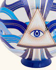 Detailed view of surrealist eye and triangle design on Jonathan Adler Druggist Eye Vase - a collector’s porcelain decor piece at Spacio India.