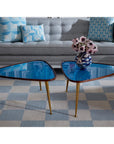 Jonathan Adler Druggist Eye Vase placed on a modern coffee table in a pastel-toned living room - surrealist designer decor now at Spacio India.