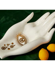 Top view of Jonathan Adler Gilded Muse Eve Fruit Bowl featuring gold eye motif on porcelain – Spacio India collection