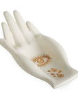 White porcelain fruit bowl shaped like a hand with gold eye and drop motifs – Jonathan Adler at Spacio India