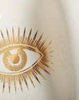Macro shot of the golden eye motif on the Jonathan Adler Gilded Muse Eve Fruit Bowl – Spacio India exclusive