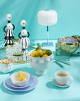 Jonathan Adler Vienna Decanters styled elegantly with luxury home accessories including candles, marble decor, and glass spheres, available at Spacio India.