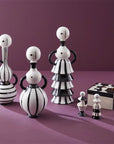 Modern home decor setting featuring Jonathan Adler Large Vienna Decanter collection, presented with complementary porcelain figures and luxurious accents, available online and at Spacio India stores.