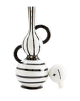 Jonathan Adler Medium Vienna Decanter in porcelain featuring black and white stripes with gold accents, elegantly placed on a marble table. Available at Spacio India retail stores and online.
