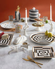 Jonathan Adler tableware collection featuring the Op Art Square Tray styled in a contemporary setting with other designer serveware, available at Spacio India.